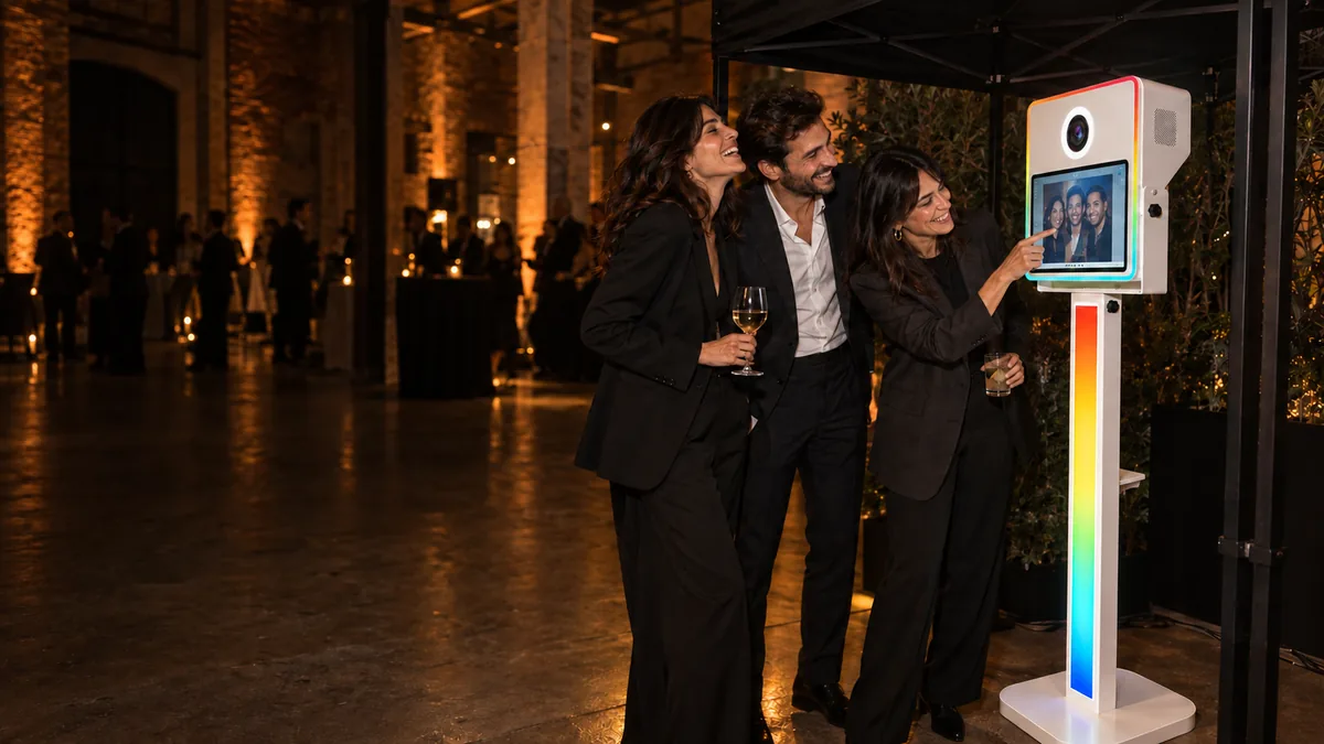 Concept: guests at an evening event with the WonderBooth totem and black gazebo