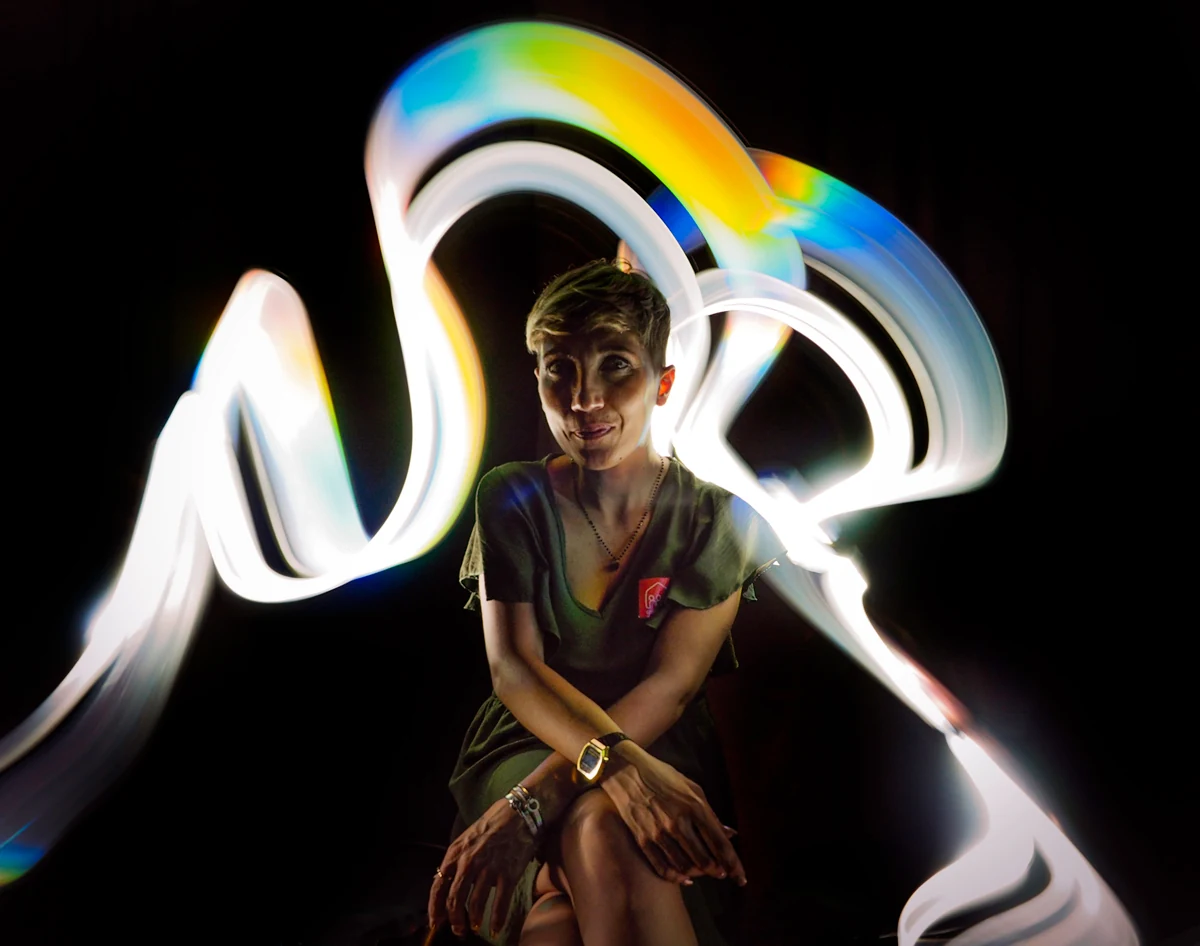 Light Painting portrait with white and multicoloured light ribbons
